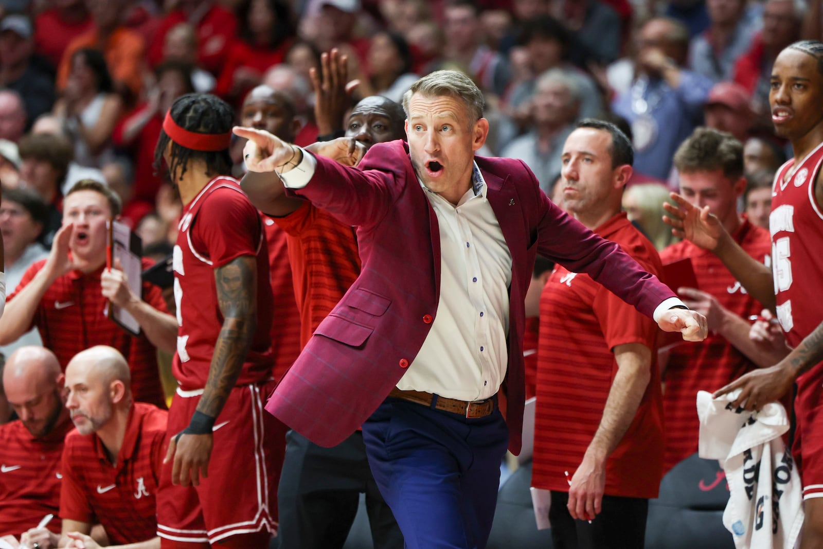 Alabama head coach Nate Oats signals in to his players during the first half of an NCAA college basketball game against Auburn, Saturday, Feb. 15, 2025, in Tuscaloosa, Ala. (AP Photo/Vasha Hunt)