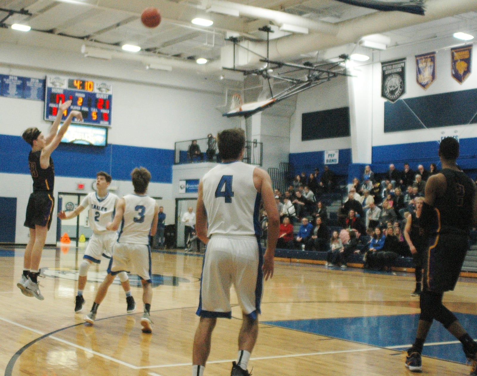 Dayton Christian’s Devin Dreier (23) shoots over Middletown Christian’s Camden Robertson (2) and Alan Holtrey (3) during Friday night’s game at MCS. Dayton Christian won 53-41. RICK CASSANO/STAFF