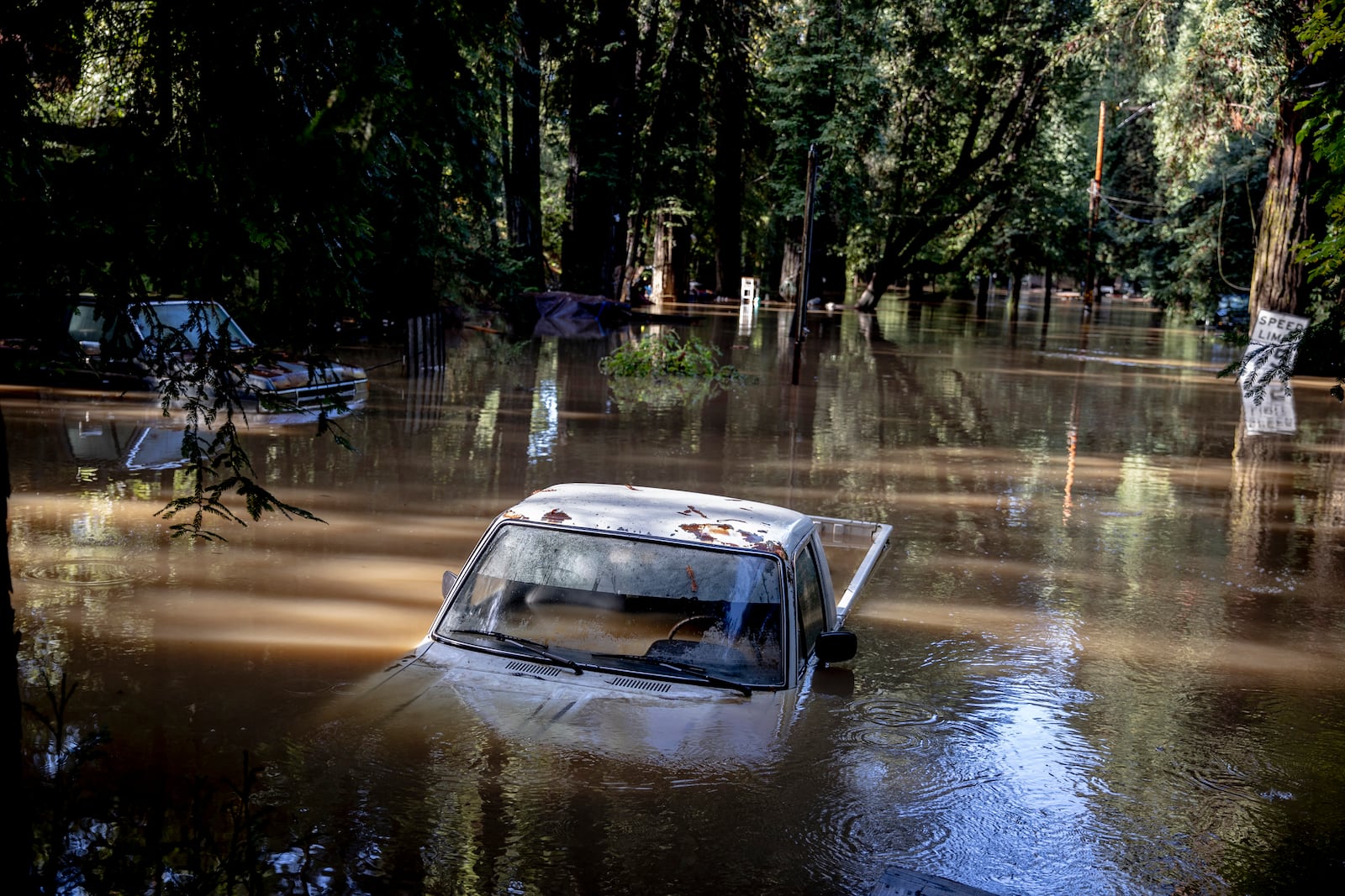 A car is seen submerged in flooded water at Mirabel RV Park & Campground after severe weather in Forestville, Calif., Saturday, Nov. 23, 2024. (Stephen Lam/San Francisco Chronicle via AP)