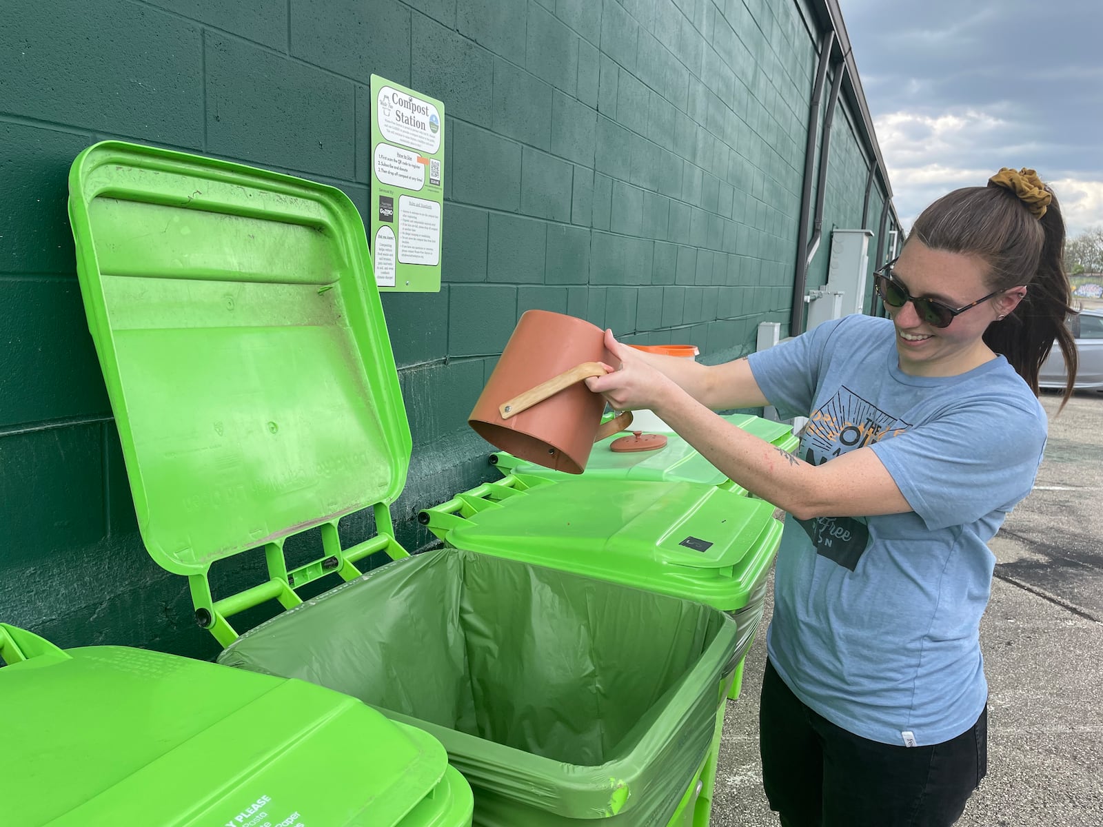 Waste-Free Dayton has teamed up with 2nd Street Market to offer a free, community compost station located on the backside of the market near Webster Street. Pictured is Natalie Warrick, founder and co-executive director of Waste-Free Dayton. NATALIE JONES/STAFF