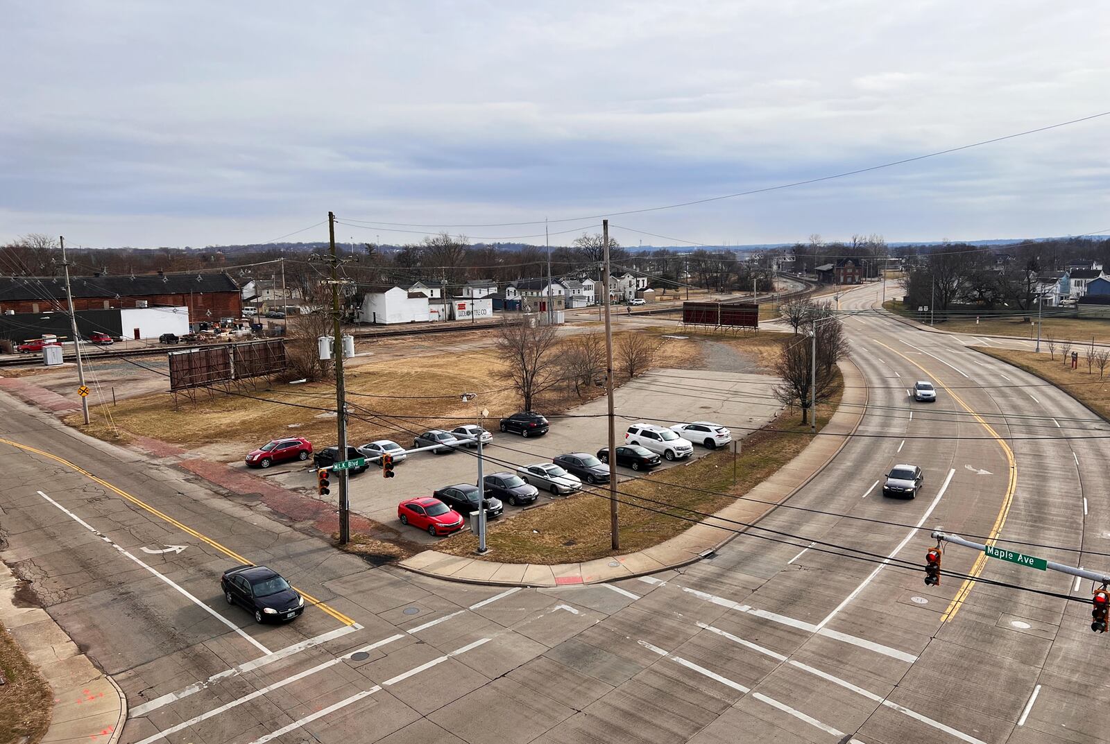 Hamilton staff is looking at creating an Amtrak station to serve the route between Cincinnati, Dayton, Springfield, Columbus and Cleveland, with a station near Maple Avenue and Martin Luther King Boulevard, where the city plans to move the historic train station. This view, from the county's downtown parking garage, shows MLK Boulevard to the right, and Maple Avenue to the right. NICK GRAHAM/STAFF