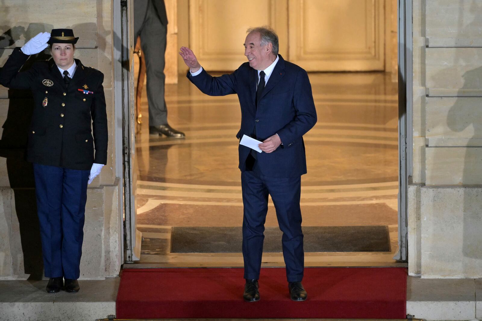 France's newly appointed Prime Minister Francois Bayrou gestures after the handover ceremony at the Hotel Matignon , the Prime Minister residence, in Paris, Friday Dec. 13, 2024.( Bertrand Guay/ Pool via AP)