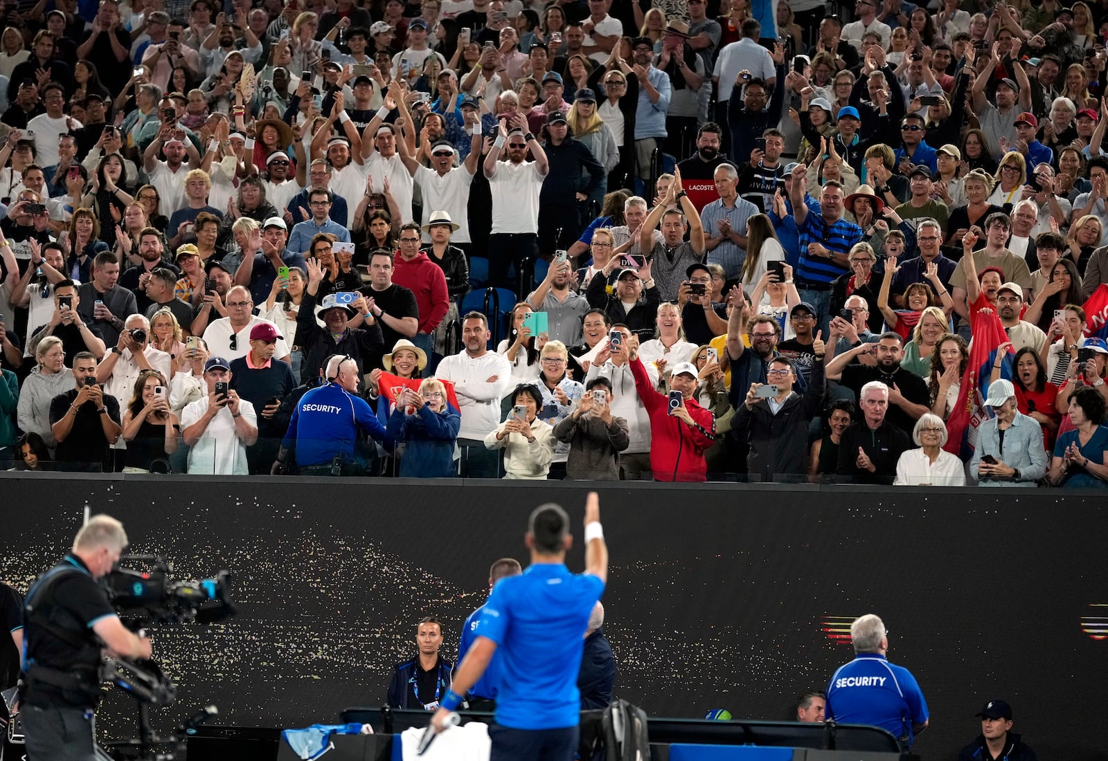 Novak Djokovic of Serbia gestures to the crowd after defeating Tomas Machac of the Czech Republic during their third round match at the Australian Open tennis championship in Melbourne, Australia, Friday, Jan. 17, 2025. (AP Photo/Asanka Brendon Ratnayake)