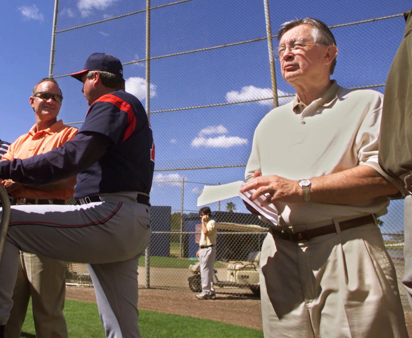 FILE - Cleveland Indians owner Larry Dolan, right, watches his team work out at Chain of Lakes Stadium in Winter Haven, Fla., Feb. 26, 2000. At left is General Manager John Hart. At center is Mike Brown, pitching coordinator. (AP Photo/Charles Krupa, File)