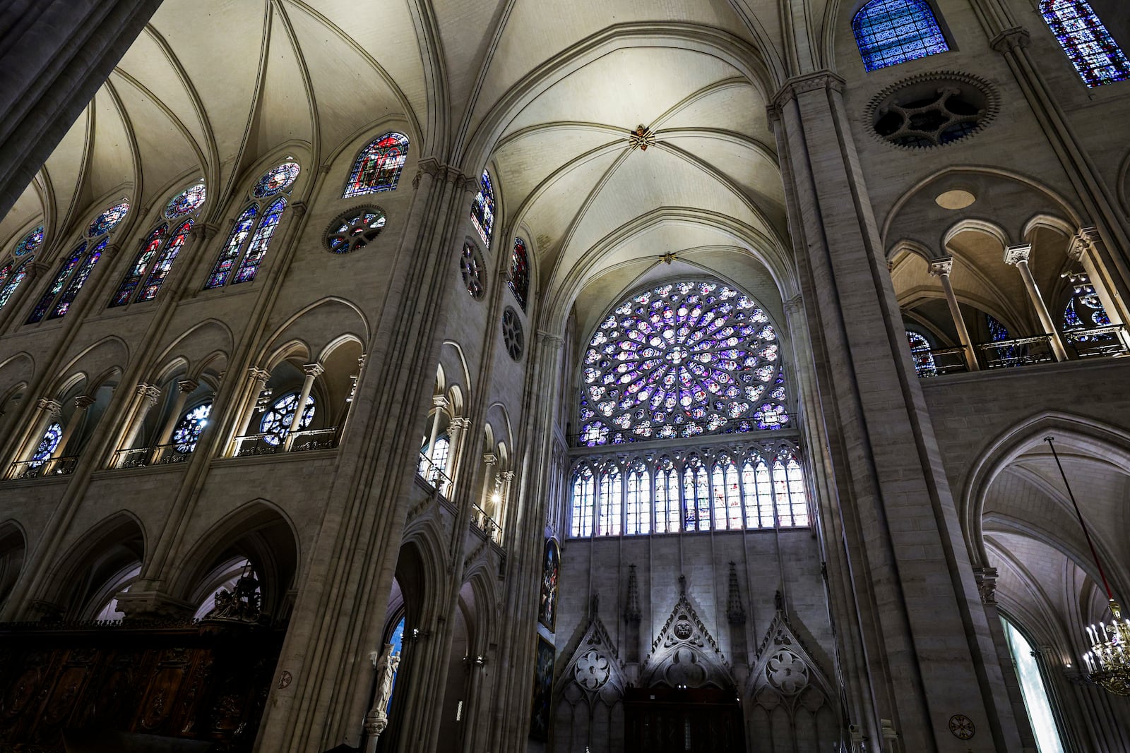 The South Rose stainglass window of Notre-Dame de Paris cathedral is seen while French President Emmanuel Macron visits the restored interiors of the cathedral, Friday Nov. 29, 2024, in Paris. (Stephane de Sakutin, Pool via AP)