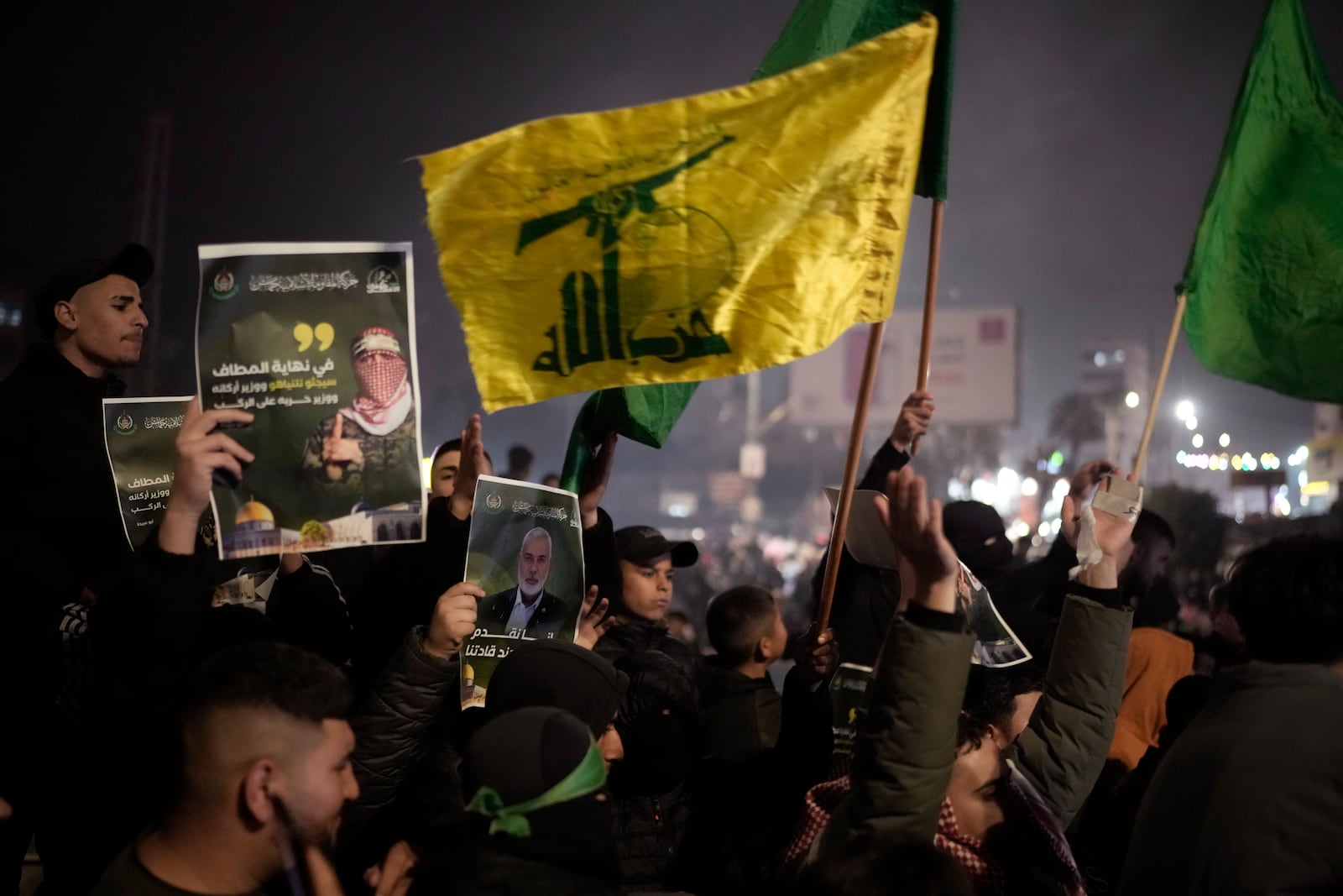 Palestinians react as they wait for the arrival of the released Palestinian prisoners, in the West Bank city of Beitunia, on Sunday, Jan. 19, 2025. (AP Photo/Leo Correa)