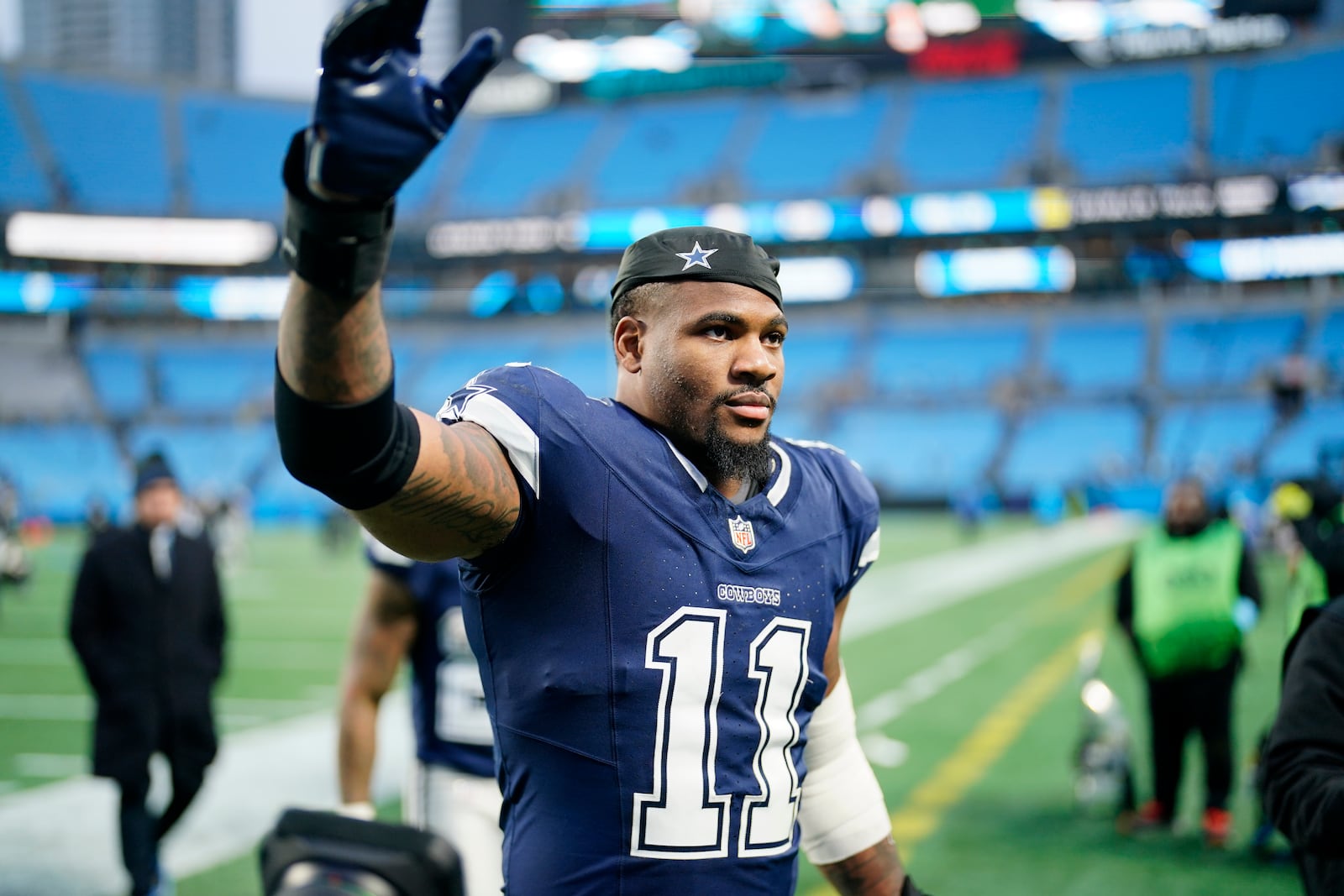 Dallas Cowboys linebacker Micah Parsons leaves the field after their win against the Carolina Panthers in an NFL football game, Sunday, Dec. 15, 2024, in Charlotte, N.C. (AP Photo/Jacob Kupferman)