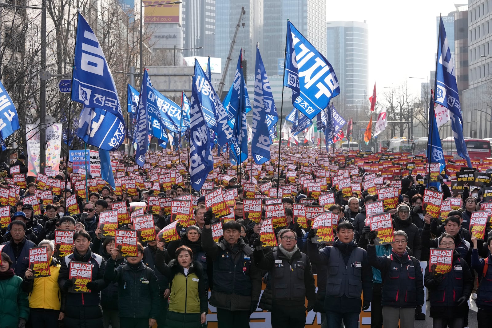 Protesters stage a rally to demand South Korean President Yoon Suk Yeol's impeachment in Seoul, South Korea, Thursday, Dec. 12, 2024. The signs read "Arrest the rebellion leader Yoon Suk Yeol." (AP Photo/Ahn Young-joon)