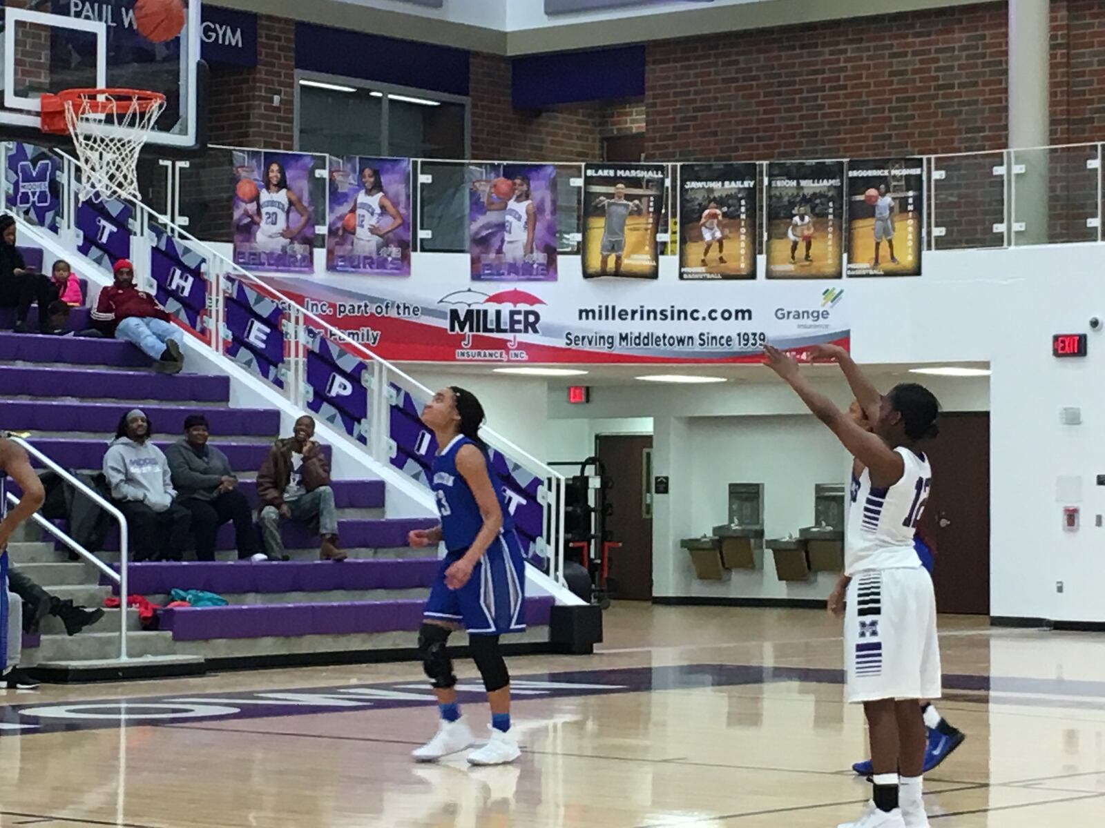 Middletown’s Aliyah Burks (12) converts a free throws as Hamilton’s Makayla Rogers watches Saturday afternoon at Wade E. Miller Arena in Middletown. RICK CASSANO/STAFF