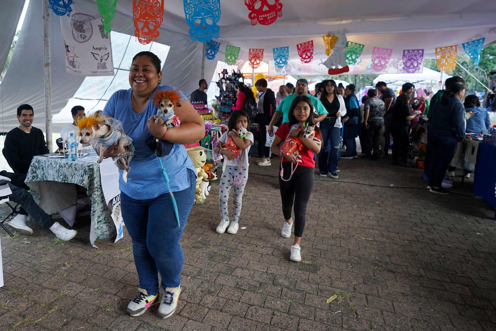 Contestants arrive to compete in a pet costume contest as part of the Day of the Dead festivities, in Mexico City, Sunday, Oct. 27, 2024. (AP Photo/Fabiola Sanchez)