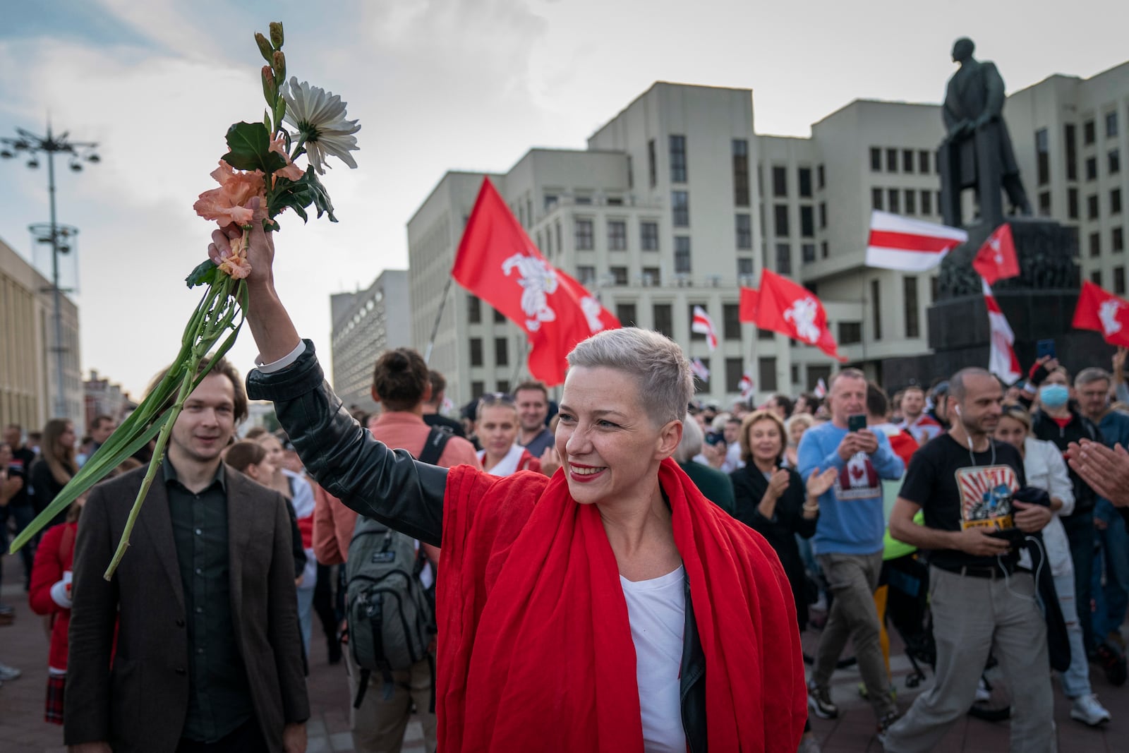 FILE – Opposition activist Maria Kolesnikova greets protesters at a rally in front of a government building in Independence Square in Minsk, Belarus, on Aug. 22, 2020. (AP Photo/Evgeniy Maloletka, File)