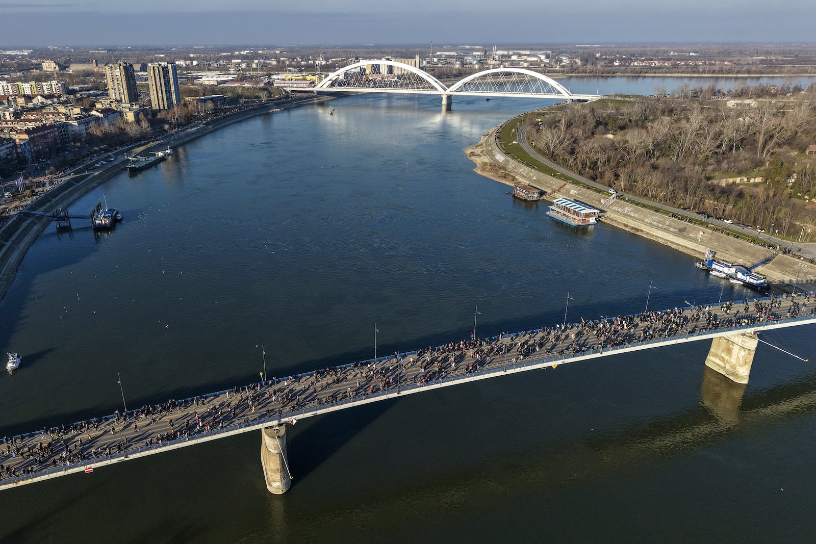 People block the Varadin bridge during a protest over the collapse of a concrete canopy killed 15 people more than two months ago, in Novi Sad, Serbia, Saturday, Feb. 1, 2025. (AP Photo/Armin Durgut)