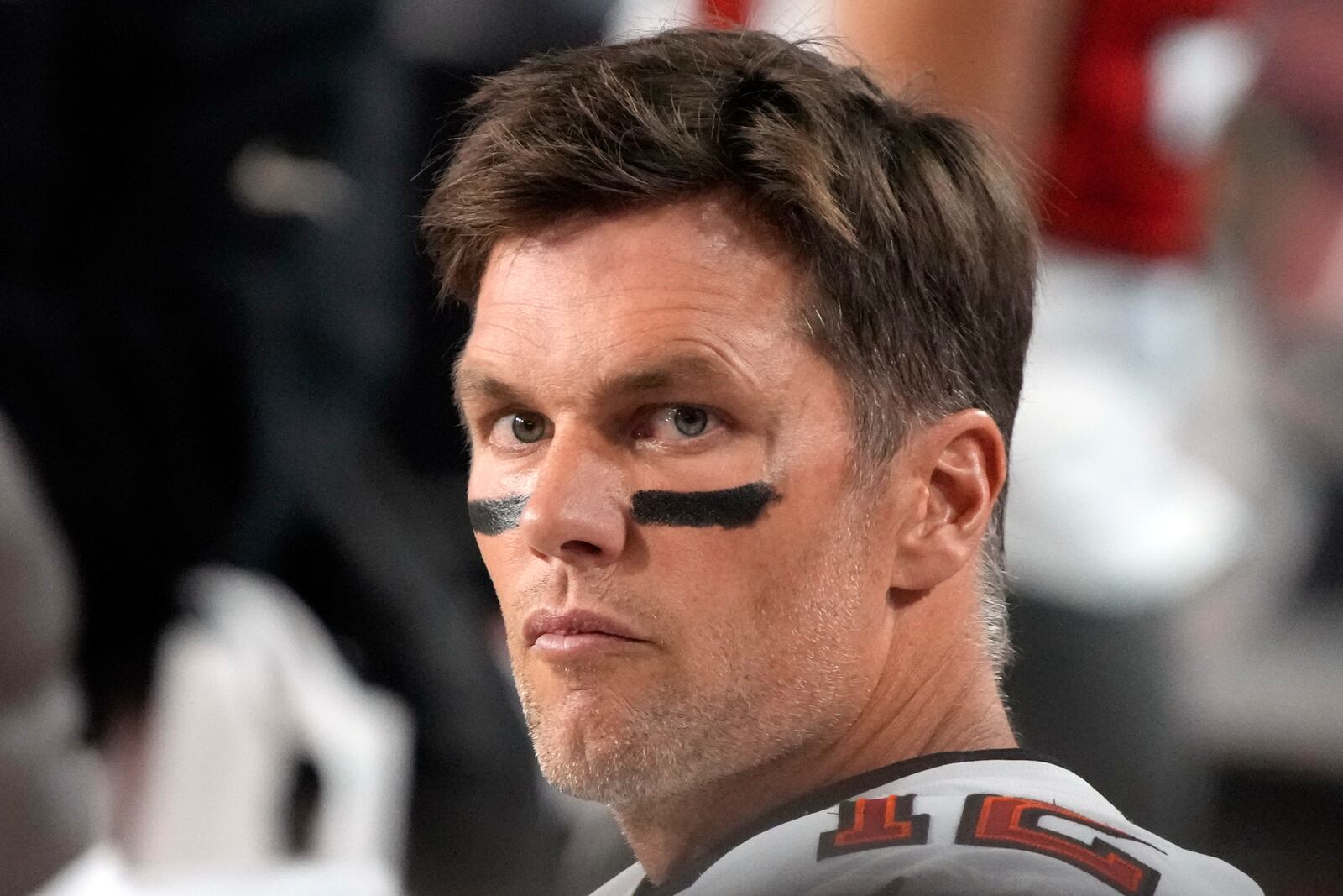 FILE - Tampa Bay Buccaneers quarterback Tom Brady looks on during the second half of an NFL football game against the Arizona Cardinals, Dec. 25, 2022, in Glendale, Ariz. (AP Photo/Rick Scuteri, File)