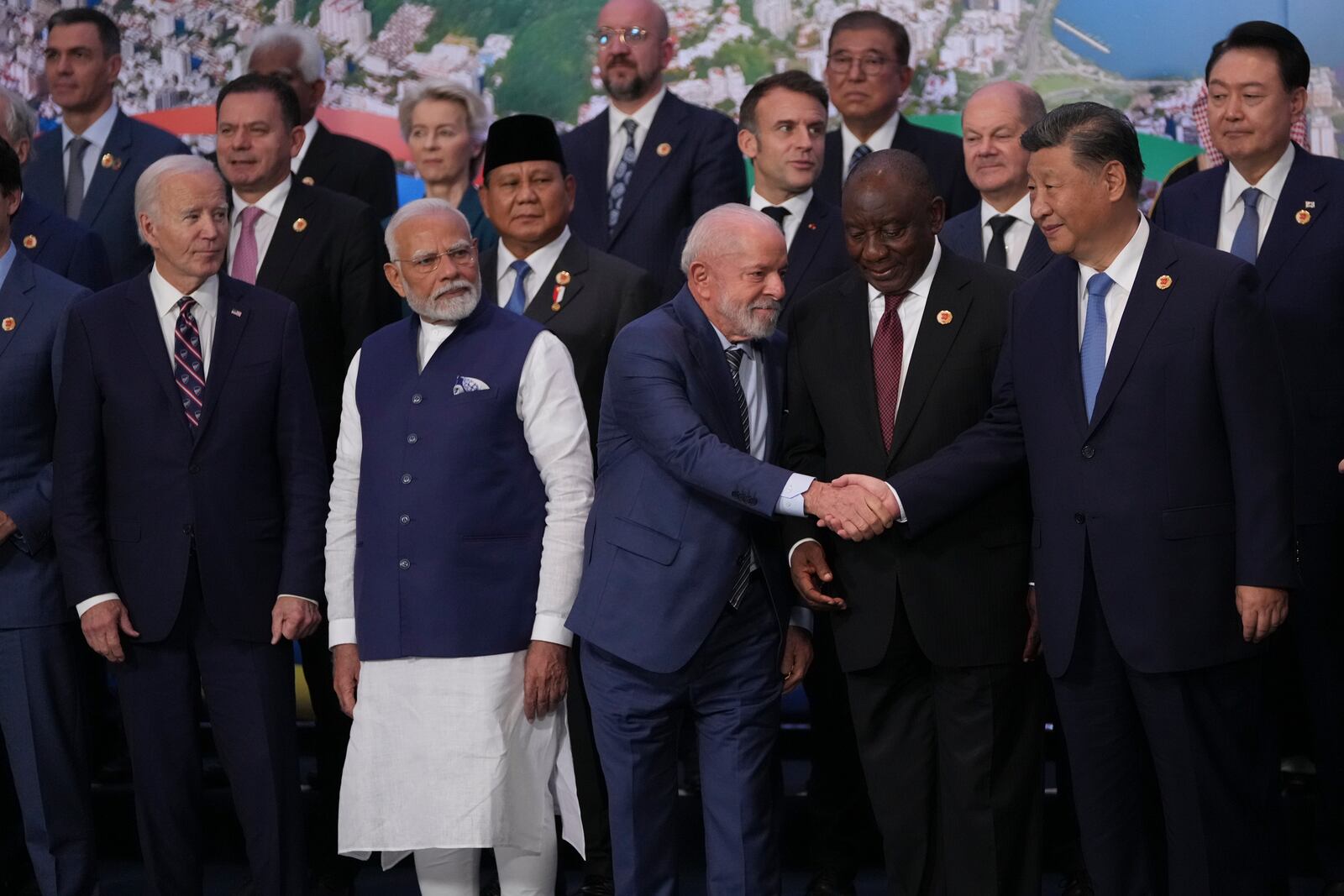 FILE - From left, U.S. President Joe Biden, India's Prime Minister Narendra Modi, Brazil's President Luiz Inacio Lula da Silva, South Africa's President Cyril Ramaphosa and China's President Xi Jinping gather for a G20 Summit world leaders' group photo, in Rio de Janeiro on Nov. 19, 2024. (AP Photo/Silvia Izquierdo, File)