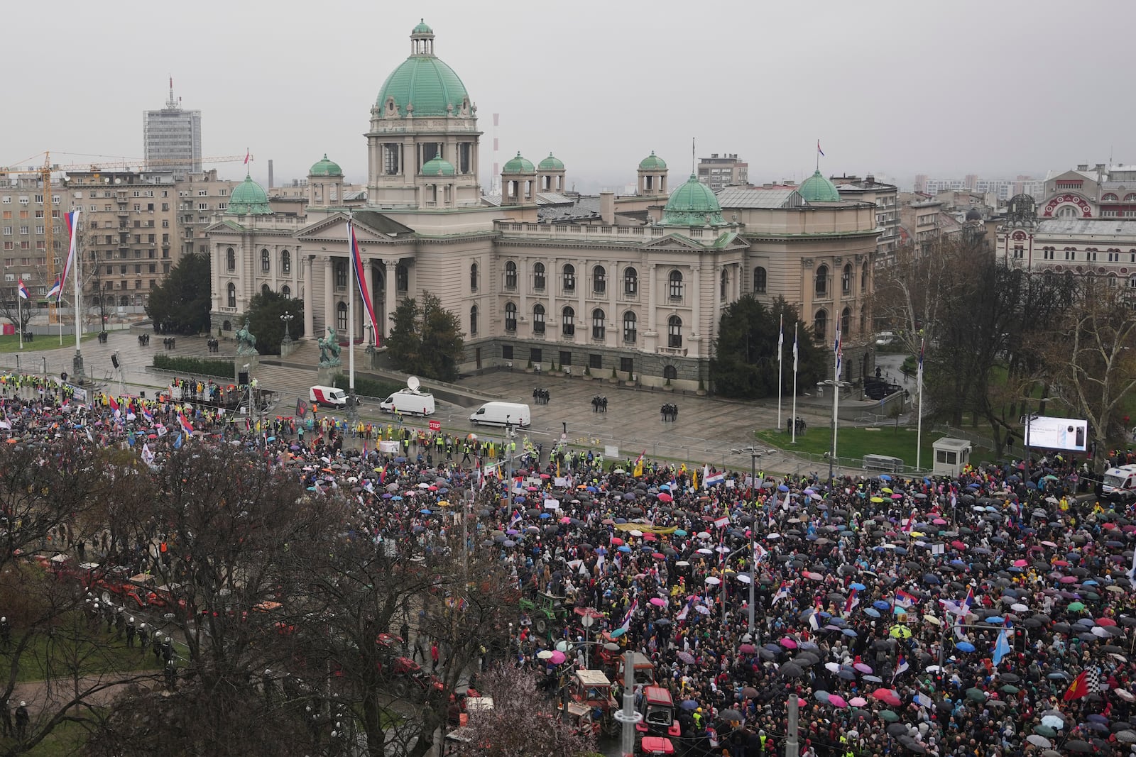 Protesters march past the Parliament building during a major rally against populist President Aleksandar Vucic and his government, in downtown Belgrade, Serbia, Saturday, March 15, 2025. (AP Photo/Darko Vojinovic)