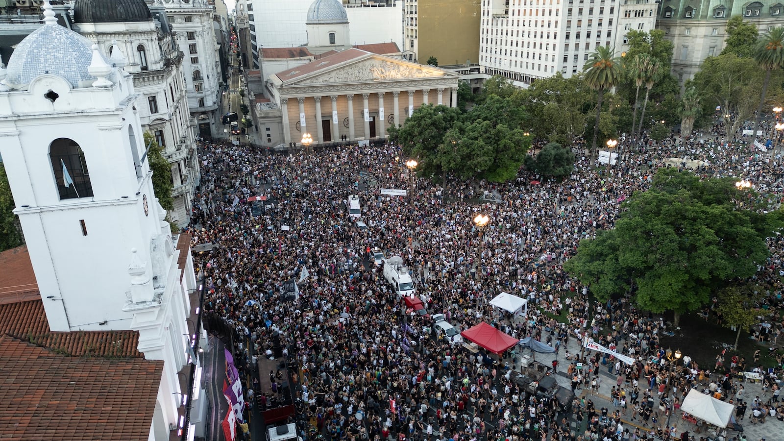 People gather in Buenos Aires, Argentina, Saturday, Feb. 1, 2025, to protest President Javier Milei’s speech at the World Economic Forum in Davos, during which he criticized “sick wokeism,” social welfare, feminism, identity politics and the fight against climate change. (AP Photo/Rodrigo Abd)