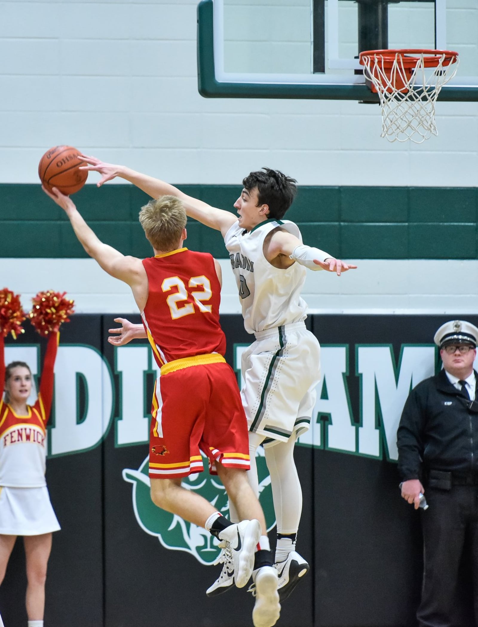 Badin’s Jakob Tipton defends a shot by Fenwick’s C.J. Napier during a game Jan. 19, 2018, at Mulcahey Gym in Hamilton. Fenwick won 61-56 in overtime. NICK GRAHAM/STAFF