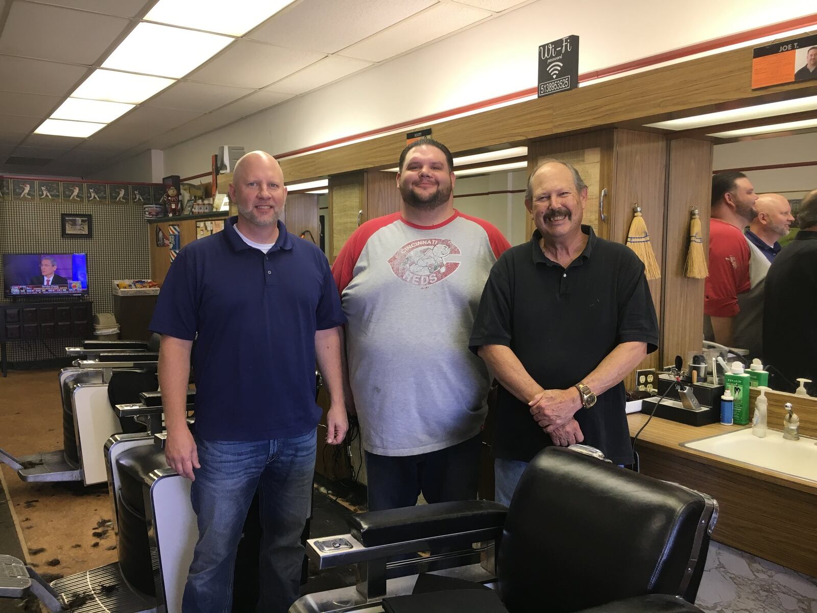 Barbers (from left) Ryan Haynes, Scott Page and Steve Mallicote at the Hamilton West Barber Shop, which has been open more than five decades. 