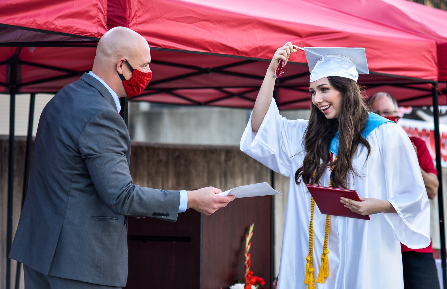 Madison High School drive-thru graduation ceremony at Land of Illusion