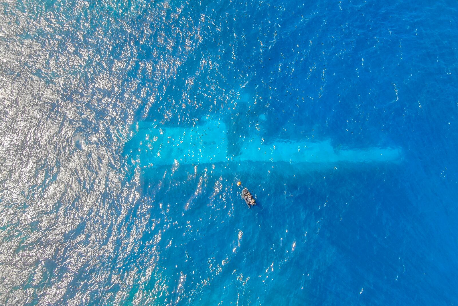 FILE - In this photo provided by the New Zealand Defence Force, divers survey the area around HMNZS Manawanui on the southern coast of Upulo, Samoa, after the Manawanui ran aground and sank on Oct. 6. (AC Jese Somerville/New Zealand Defence Force via AP,File)