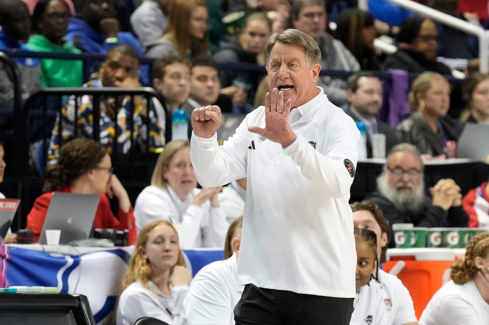 NC State head coach Wes Moore directs his team against Duke during an NCAA college basketball game in the championship of the Atlantic Coast Conference tournament Greensboro, N.C., Sunday, March 9, 2025. (AP Photo/Chuck Burton)