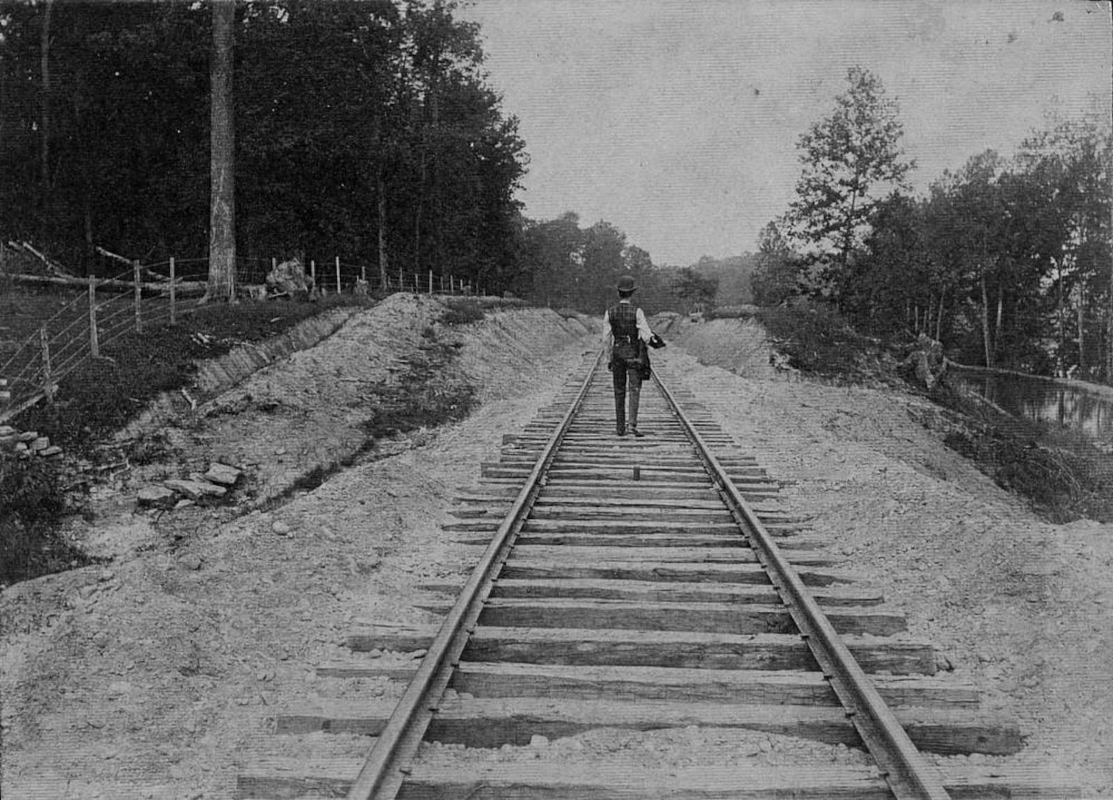 The Louisville, Cincinnati and Dayton Railroad was completed April 1, 1887, when trains began to operate between Hamilton and Middletown. It was built as a vital link in a speedy coast-to-coast network with Hamilton as a key city. It also was planned to enhance businesses, particularly  icehouses along the Miami-Erie Canal, which is on the right in this photograph. CREDIT: MIDPOINTE LIBRARY COLLECTION