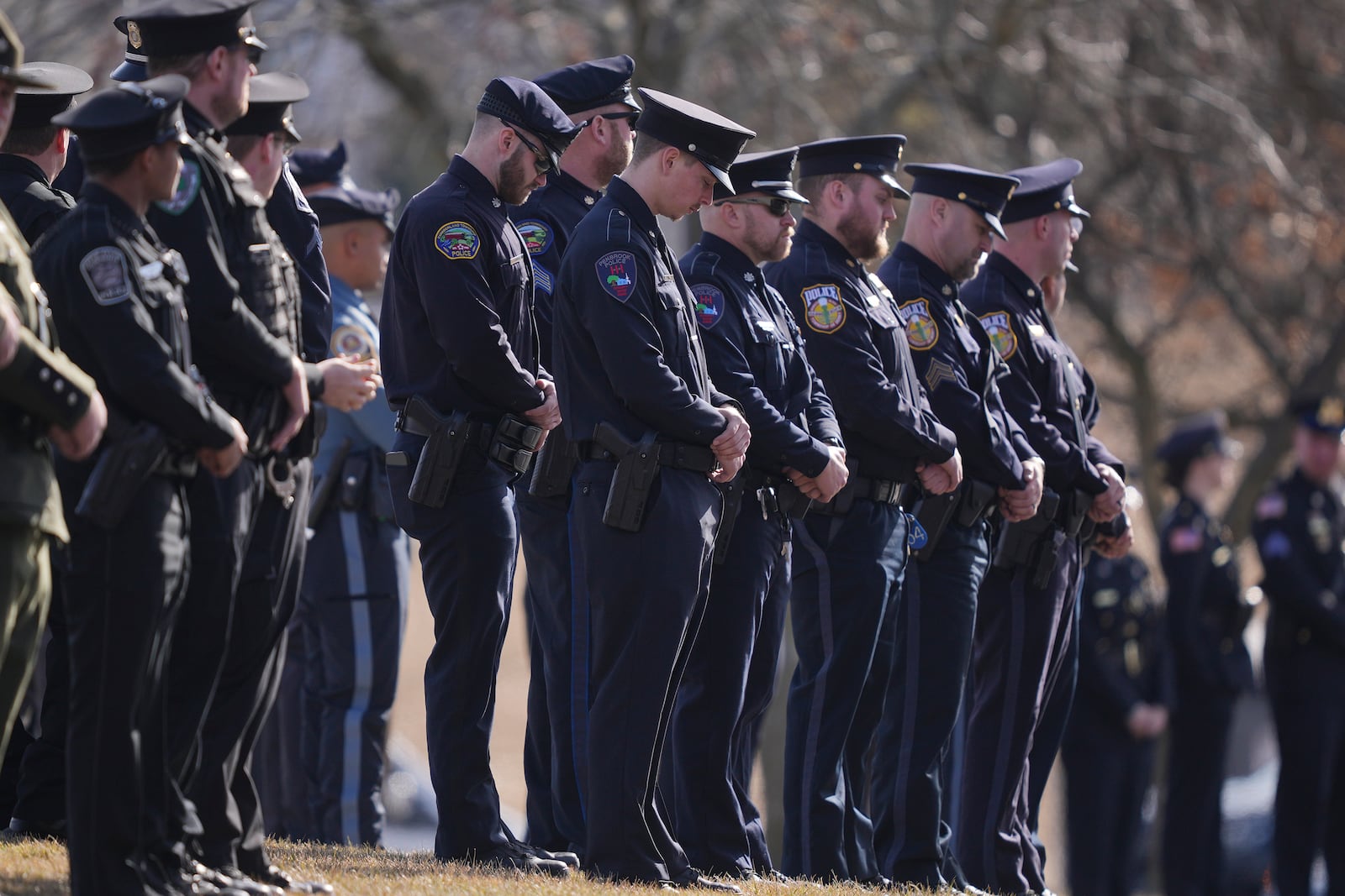 Officers wait for slain West York Borough Police Officer Andrew Duarte's funeral procession from Living Word Community Church, in Red Lion, Pa., Friday, Feb. 28, 2025. (AP Photo/Matt Rourke)