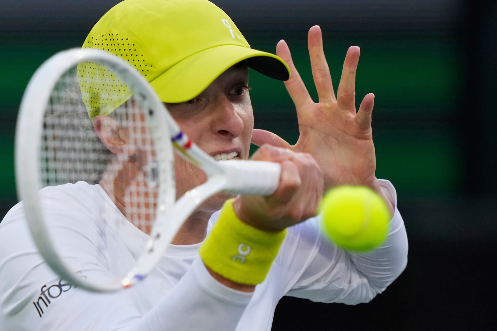 Iga Swiatek, of Poland, returns to Mirra Andreeva, of Russia, during the semifinals at the BNP Paribas Open tennis tournament Friday, March 14, 2025, in Indian Wells, Calif. (AP Photo/Mark J. Terrill)