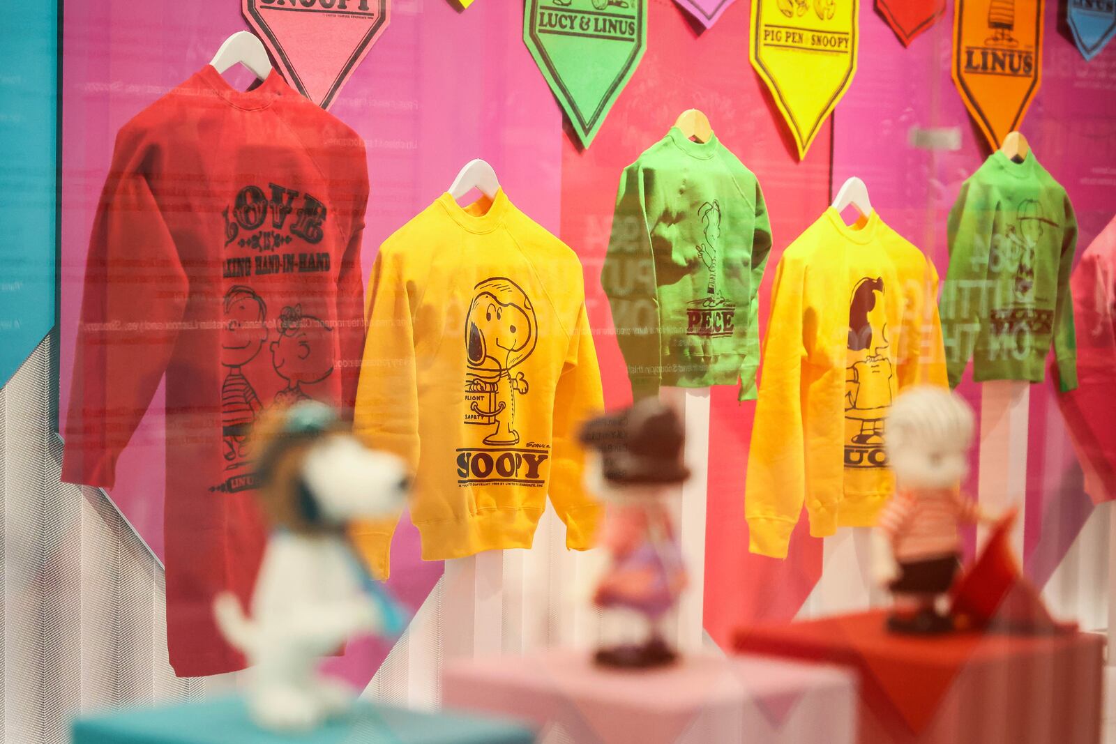 Jerseys printed with Snoopy characters ar displayed as part of Peanuts' 75th Anniversary, at the Snoopy In Style exhibition that runs from March 22 through April 5, in Paris Thursday, March 20, 2025. (AP Photo/Thomas Padilla)