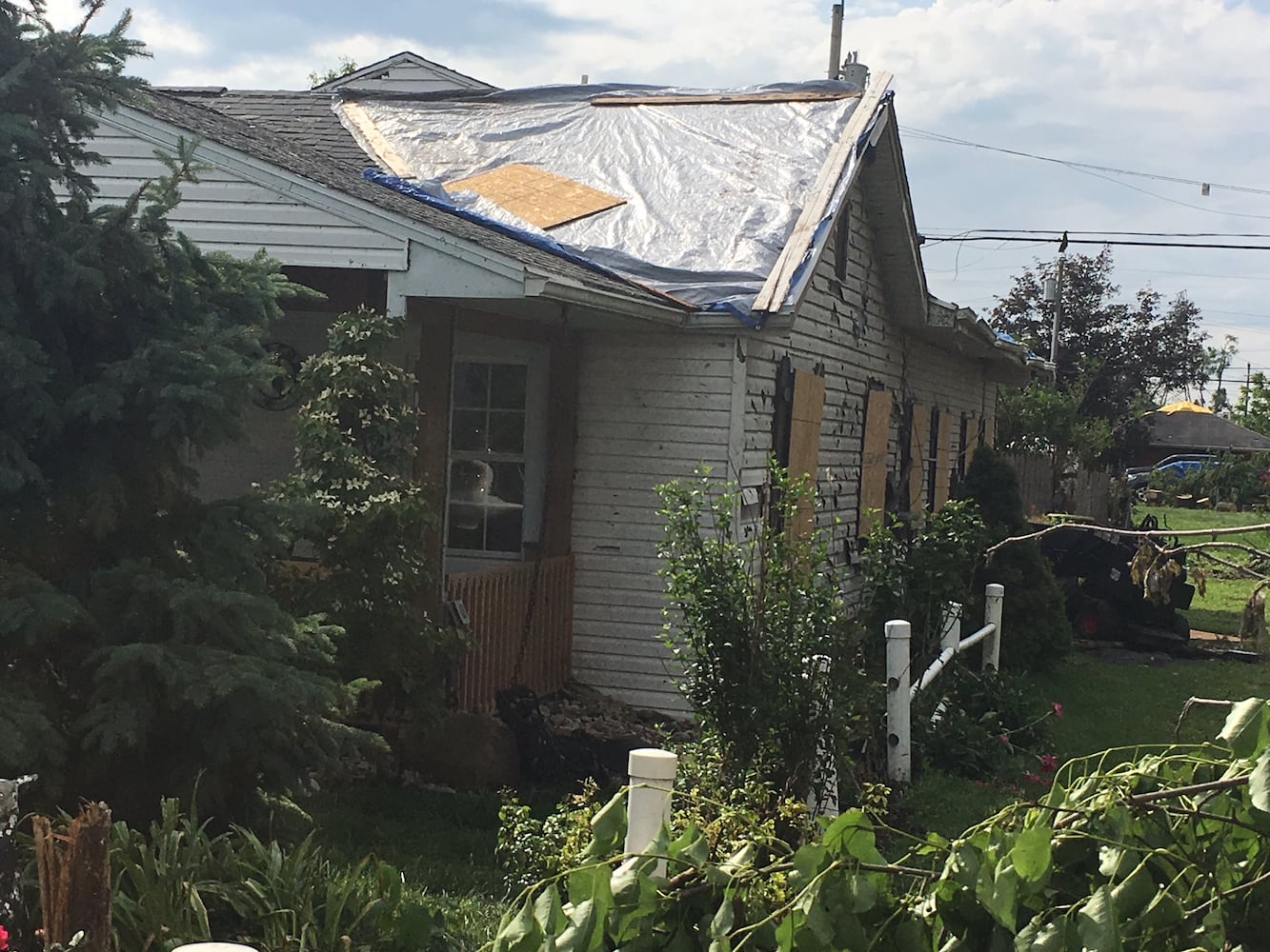 PHOTOS: Tornado-damaged communities dig out, clean up