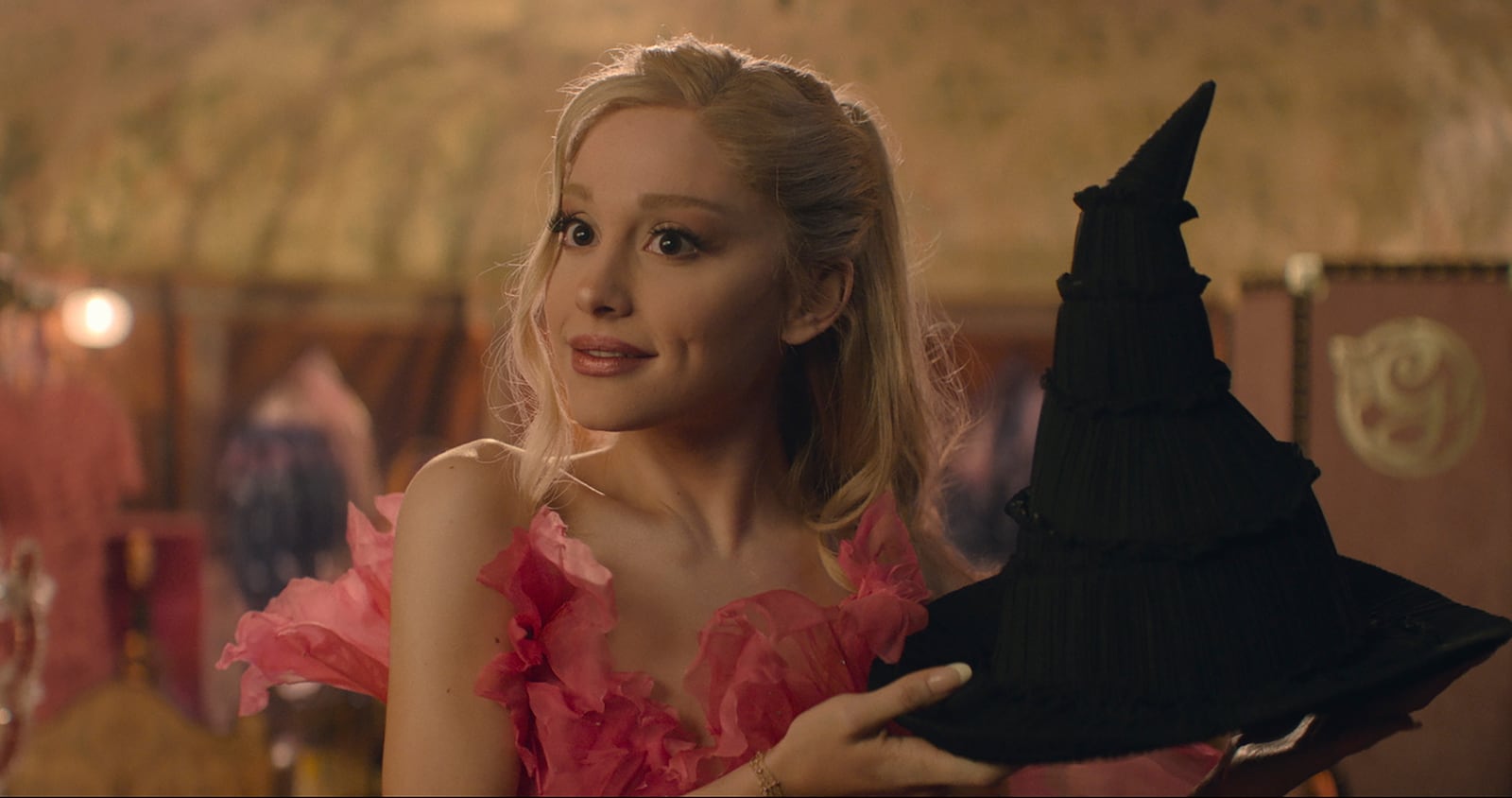 This image released by Universal Pictures shows Ariana Granda as Glinda in the film "Wicked." (Universal Pictures via AP)