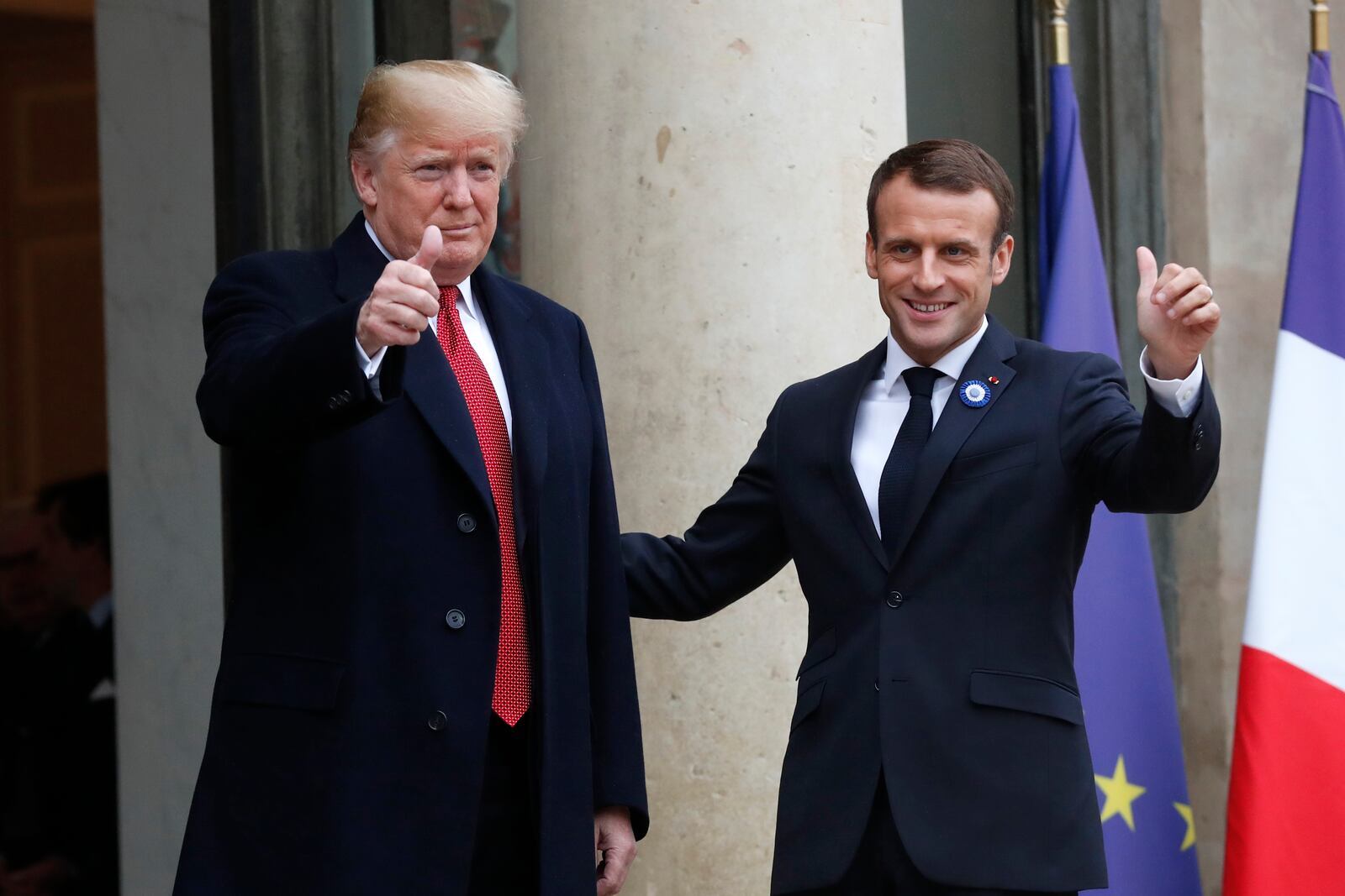 FILE - French President Emmanuel Macron, right, and U.S President Donald Trump thumb up at the Elysee Palace in Paris, Saturday, Nov.10, 2018. (AP Photo/Thibault Camus, File)