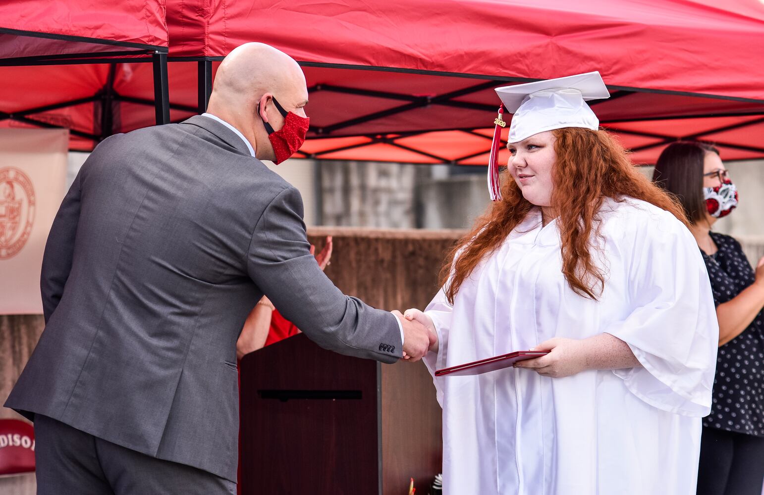 Madison High School drive-thru graduation ceremony at Land of Illusion