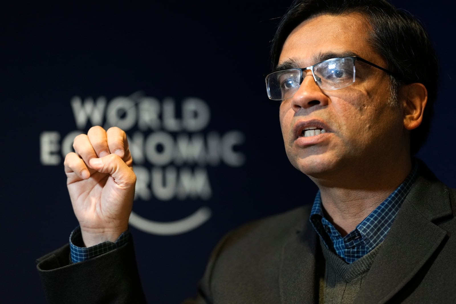 Amitabh Behar, executive director of Oxfam International speaks to The Associated Press during an interview ahead of the Annual Meeting of the World Economy Forum in Davos, Switzerland, Sunday, Jan. 19, 2025. (AP Photo/Markus Schreiber)