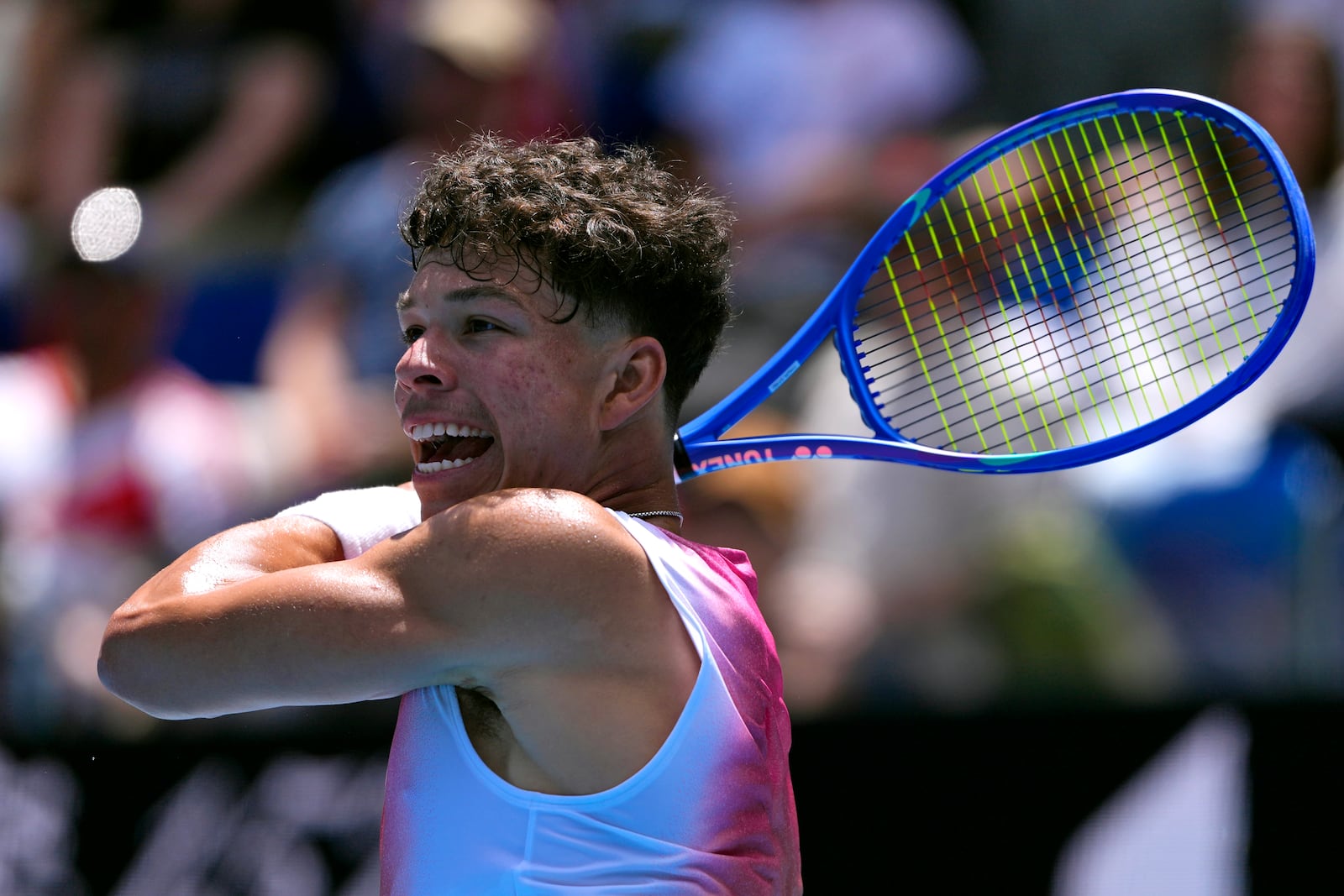 Ben Shelton of the U.S. plays a forehand return to Pablo Carreno Busta of Spain during their second round match at the Australian Open tennis championship in Melbourne, Australia, Thursday, Jan. 16, 2025. (AP Photo/Vincent Thian)