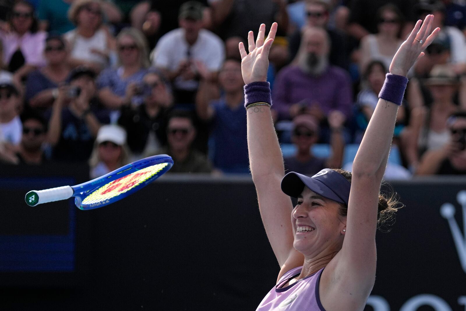 Belinda Bencic of Switzerland celebrates after defeating Jelena Ostapenko of Latvia in their first round match at the Australian Open tennis championship in Melbourne, Australia, Monday, Jan. 13, 2025. (AP Photo/Vincent Thian)