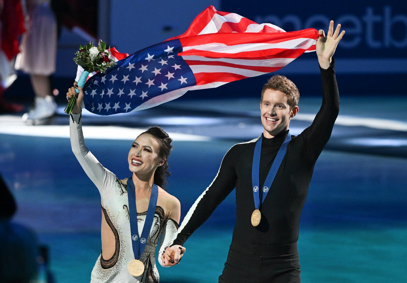 FILE - Madison Chock and Evan Bates, of the United States, wave to fans as they celebrate their victory in the ice dance competition at the ISU World Figure Skating Championships in Montreal, March 23, 2024. (Graham Hughes/The Canadian Press via AP, File)