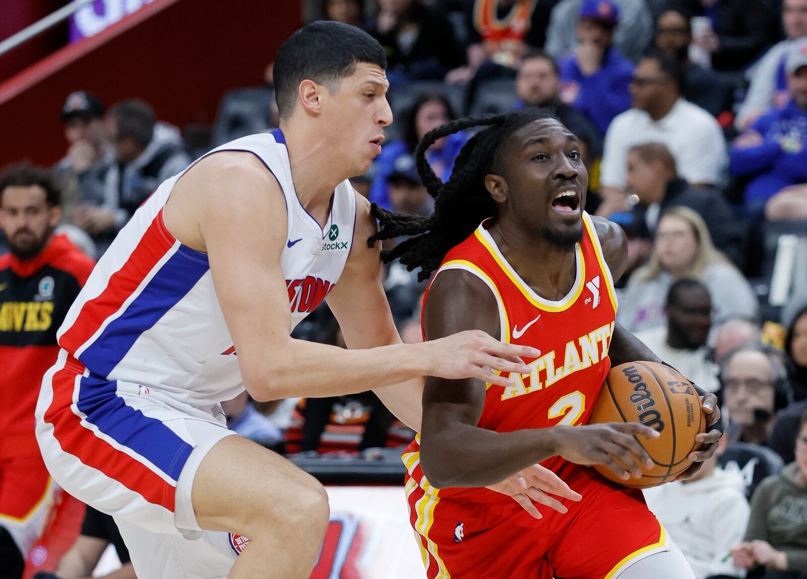 Atlanta Hawks guard Keaton Wallace (2) is defended by Detroit Pistons forward Simone Fontecchio, left, while driving to the basket during the first half of an NBA basketball game Monday, Feb. 3, 2025, in Detroit. (AP Photo/Duane Burleson)