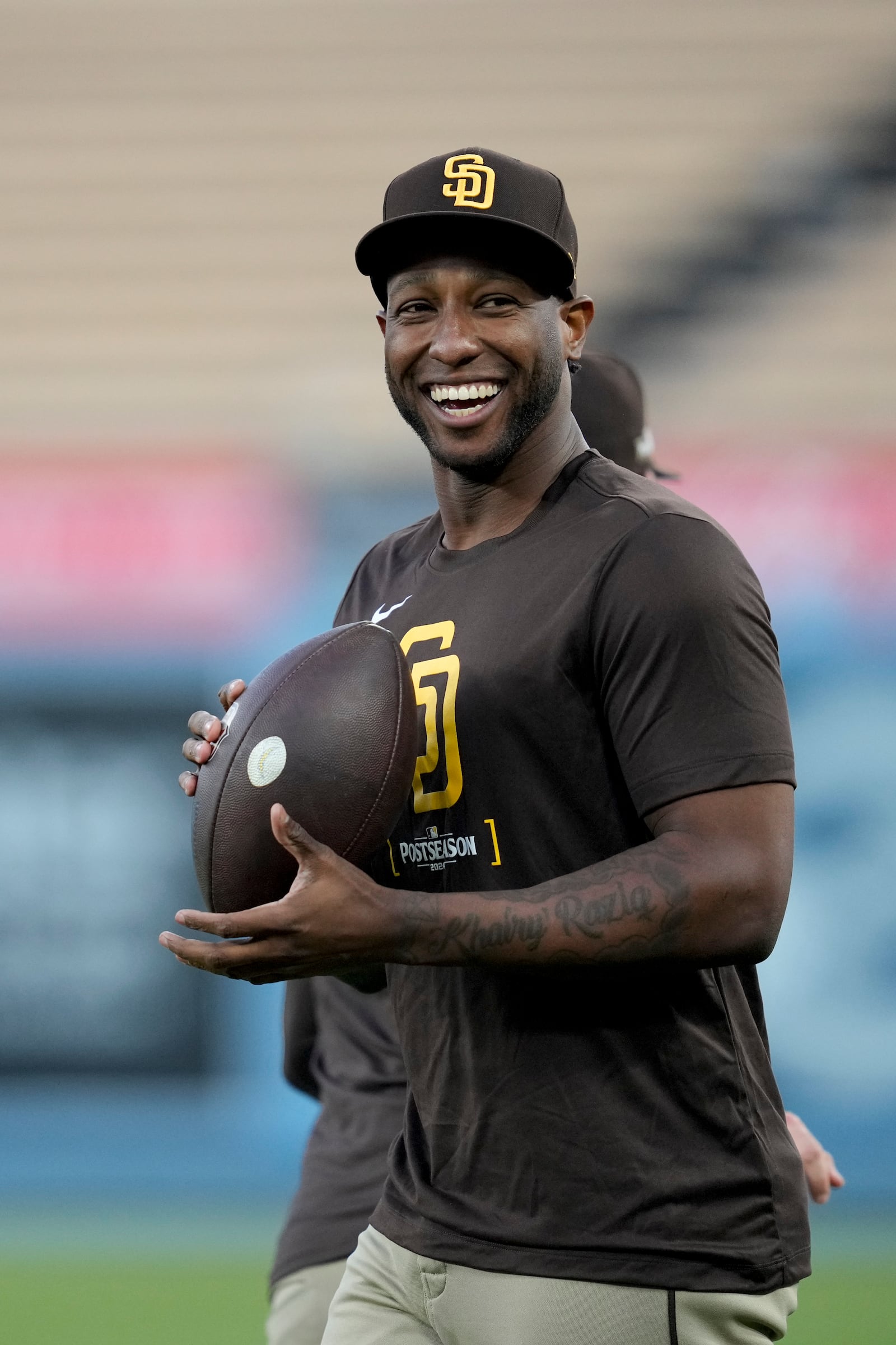 San Diego Padres' Jurickson Profar smiles during practice ahead of Game 5 of a baseball National League Division Series against the Los Angeles Dodgers, Thursday, Oct. 10, 2024, in Los Angeles. (AP Photo/Ashley Landis)