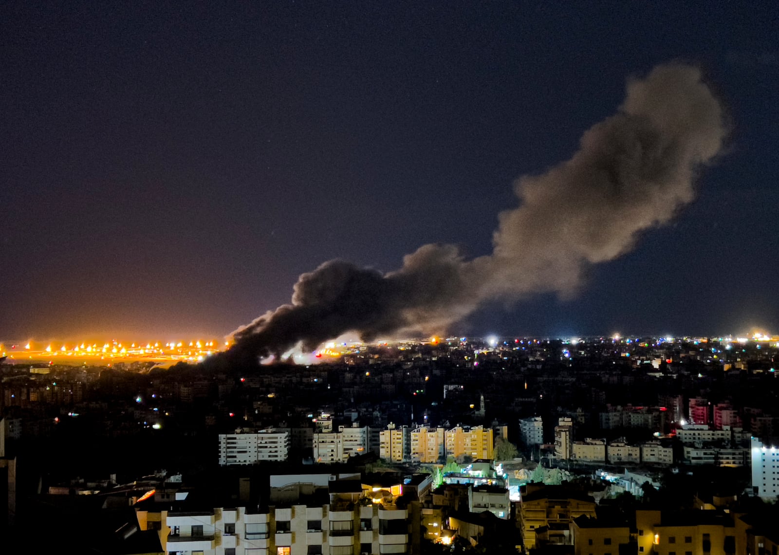 Smoke rises from an Israeli airstrike that hit the southern suburb of Beirut, Lebanon, Tuesday, Oct. 1, 2024. (AP Photo/Hussein Malla)