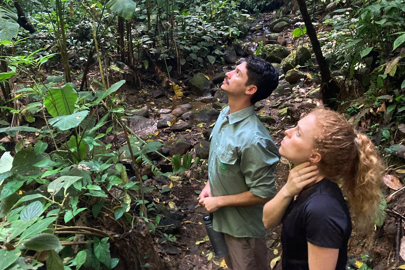 FILE - Biologists Jim Córdoba-Alfaro, left, and Jenna Lawson listen for the sounds of endangered Geoffrey's spider monkeys at the private Rio Nuevo Nature Reserve on the Osa Peninsula in Costa Rica, on March 20, 2023. (AP Photo/Matt O'Brien, File)