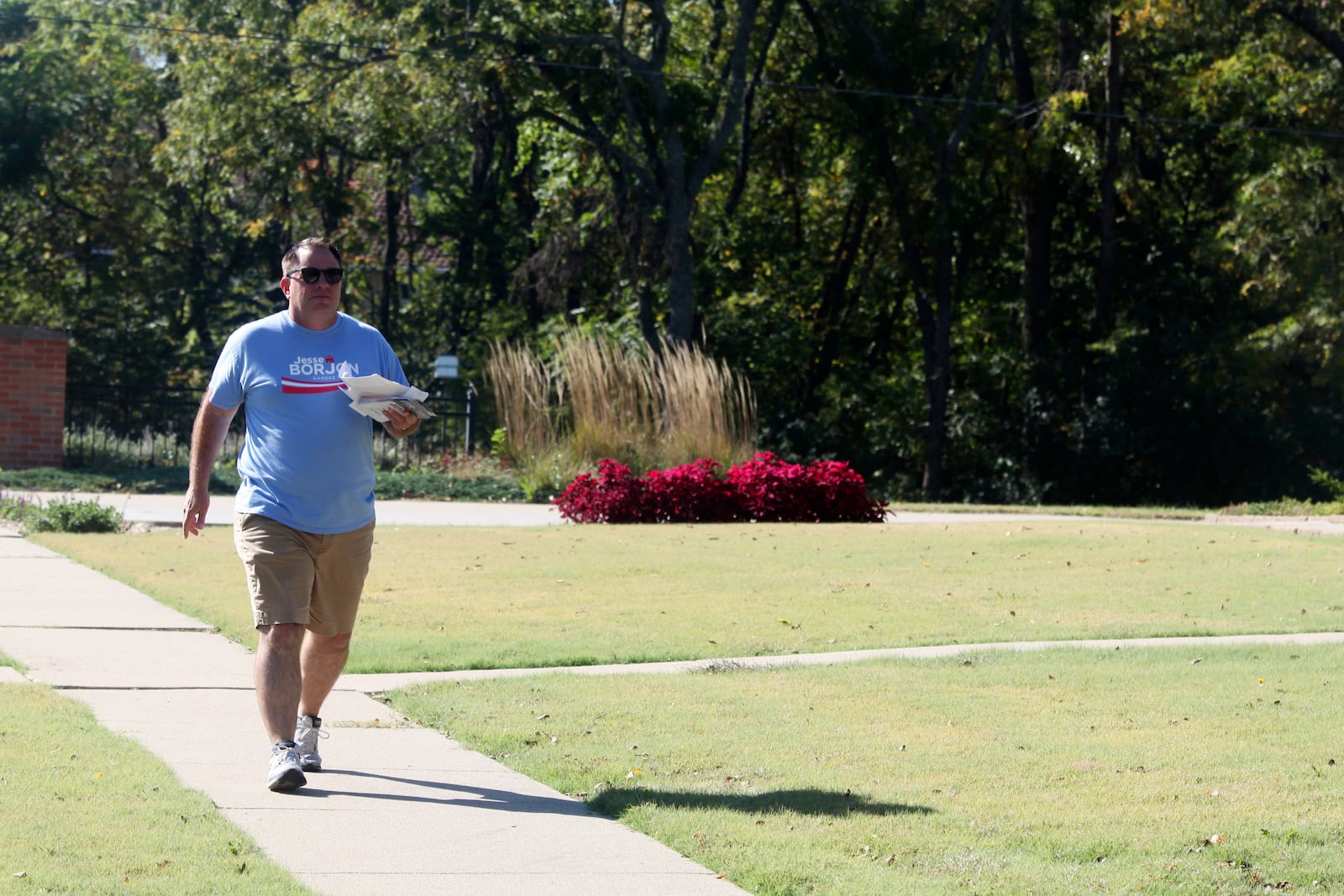 Kansas state Rep. Jesse Borjon, R-Topeka, campaigns door to door, Saturday, Oct. 5, 2024, in Topeka, Kan. (AP Photo/John Hanna)