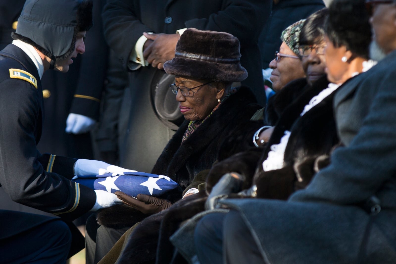 FILE - An American flag is presented to Nancy Leftenant-Colon during a memorial service for her brother, Tuskegee Airmen, 2nd Lt. Samuel G. Leftenant, at Arlington National Cemetery in Arlington, Va., Jan. 14, 2016. Leftenant-Colon, who was the first Black woman to join the U.S. Army Nurse Corps after the military was desegregated in the 1940s, died on Jan. 8, 2025. She was 104. (AP Photo/Evan Vucci, File)