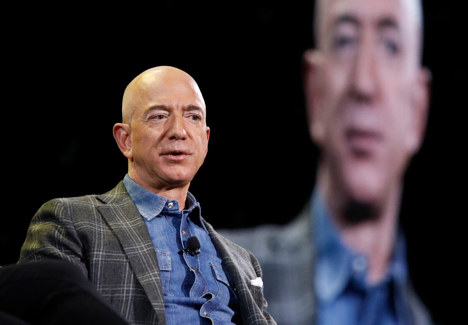 FILE - Jeff Bezos speaks at the Amazon re:MARS convention in Las Vegas, June 6, 2019. (AP Photo/John Locher, File)