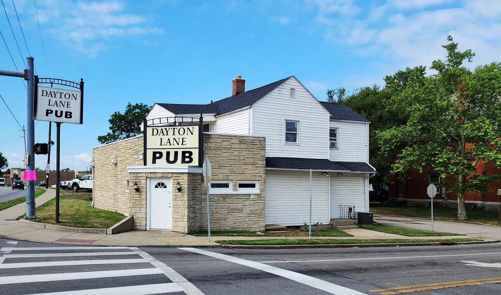 A man was shot and killed outside Dayton Lane Pub Sunday night in Hamilton. NICK GRAHAM/STAFF