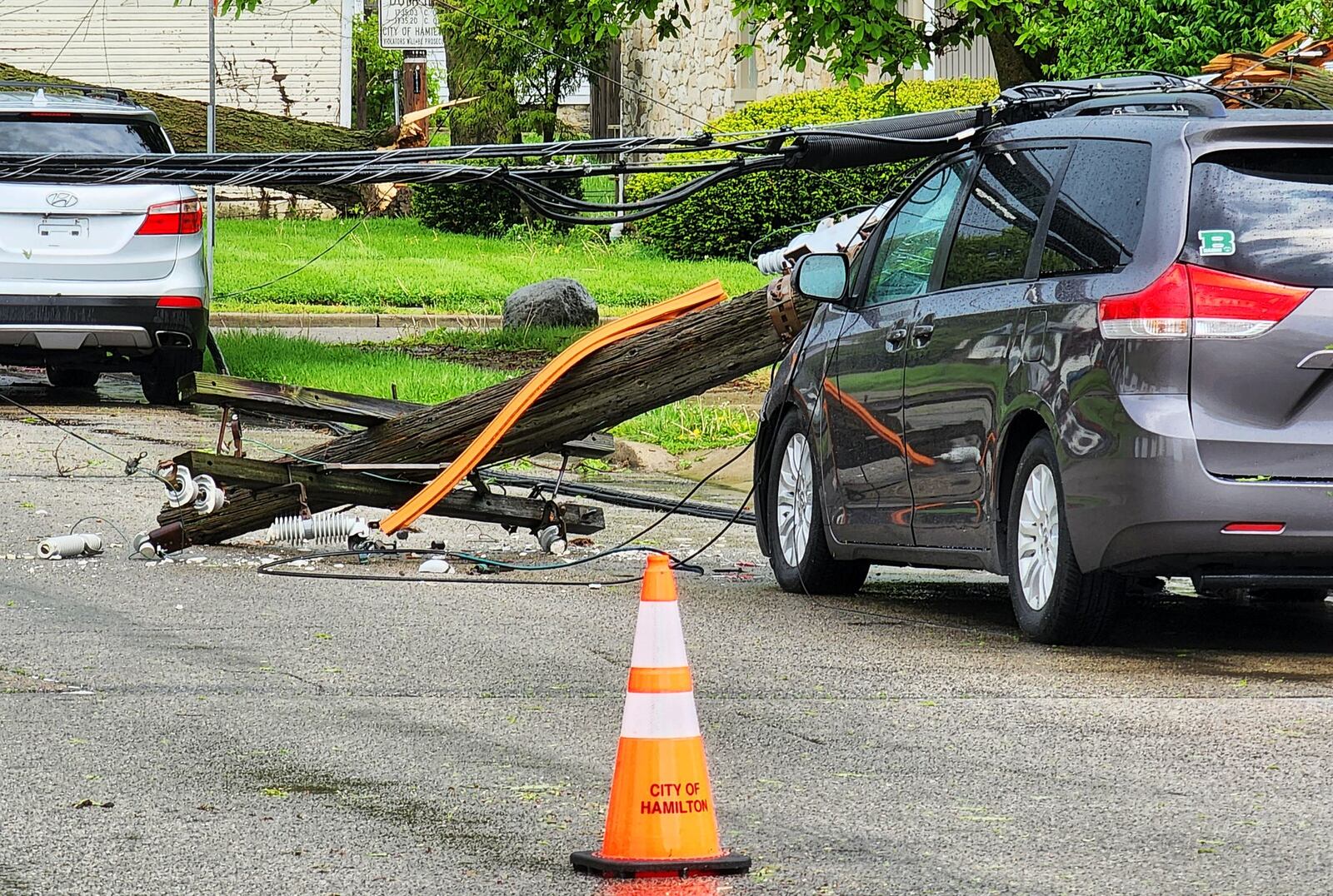 A vehicle near North 'F' Street and Liberty Avenue in Hamilton was struck during a storm that rolled through around 3 p.m. Tues., May 3, 2022. NICK GRAHAM/STAFF