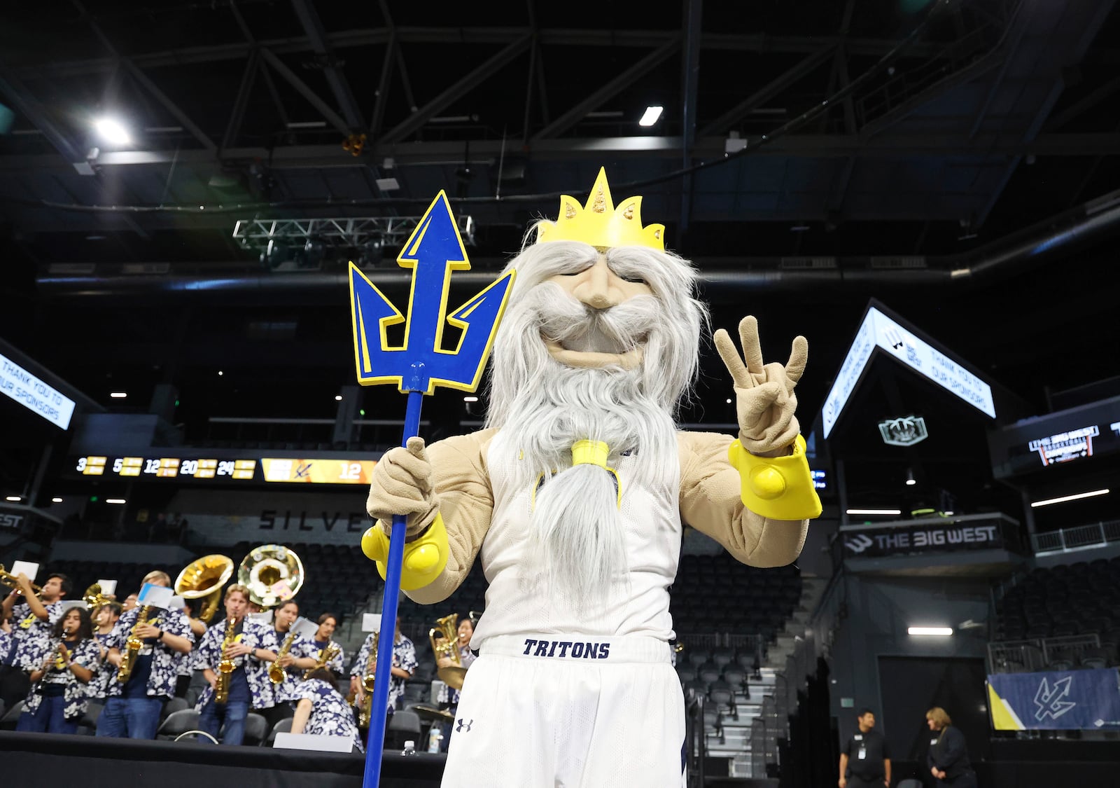 UC San Diego mascot King Triton cheers from Sand Diego's court in the first half of an NCAA college basketball game in the championship of the Big West Conference tournament Saturday, March 15, 2025, in Henderson, Nev. (AP Photo/Ronda Churchill)