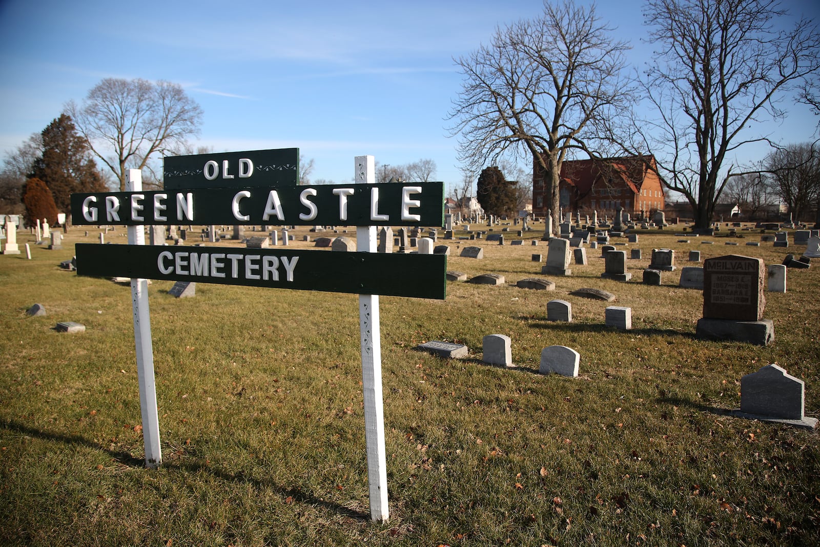 A tombstone labeled THE STRANGER marks the grave of a young woman buried at Old Greencastle Cemetery in Dayton. LISA POWELL / STAFF