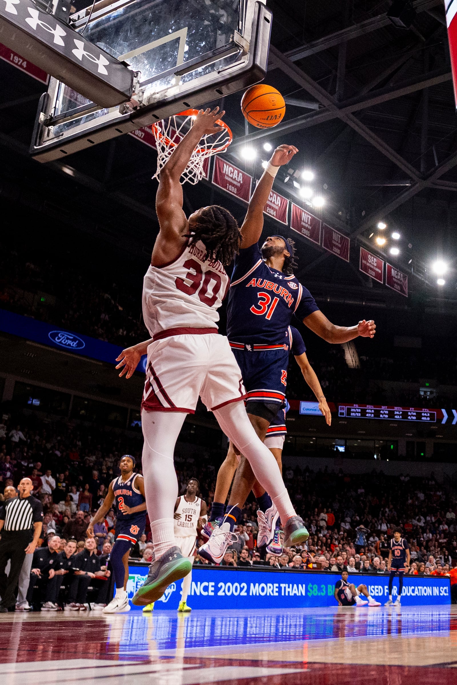 Auburn forward Chaney Johnson (31) blocks a shot by South Carolina forward Collin Murray-Boyles (30) during the second half of an NCAA college basketball game, Saturday, Jan. 11, 2025, in Columbia, SC (AP Photo/Scott Kinser)