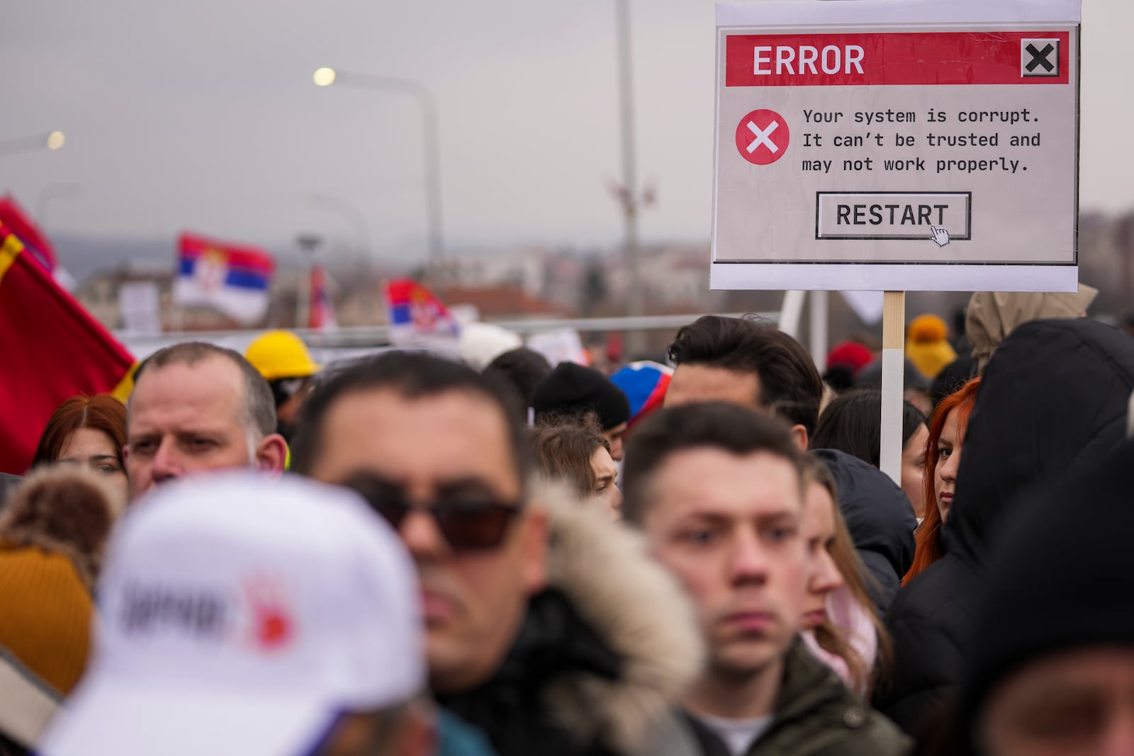 People attend a protest triggered after a concrete canopy on a railway station in the northern city of Novi Sad collapsed on Nov. 1, 2024 killed 15 people, in Kragujevac, Serbia, Saturday, Feb. 15, 2025. (AP Photo/Darko Vojinovic)